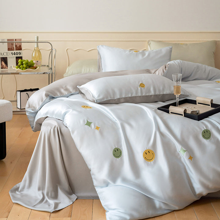 Luxurious satin bedding set with embroidered cherry motifs, reversible function and plush bunny pillow