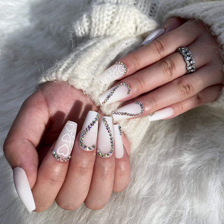 Artful Nail Extensions with Heart Design and Glitter Accents Stornfield