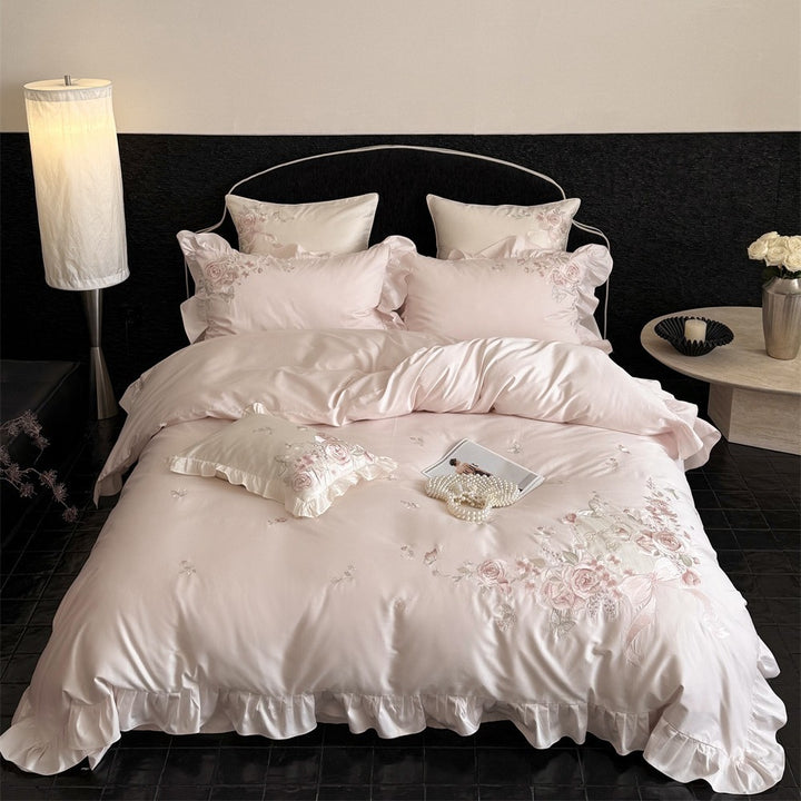 Romantic satin bed linen set with richly embroidered rose border and frill