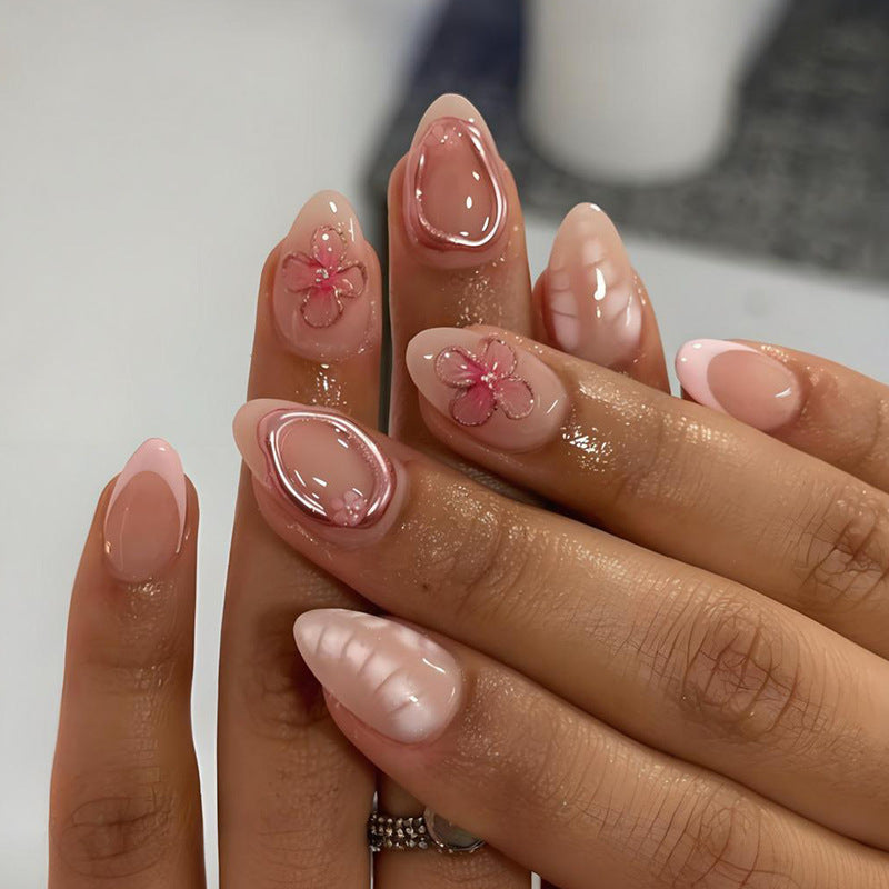 Artificial nail set with floral decorations and elegant accents Stornfield