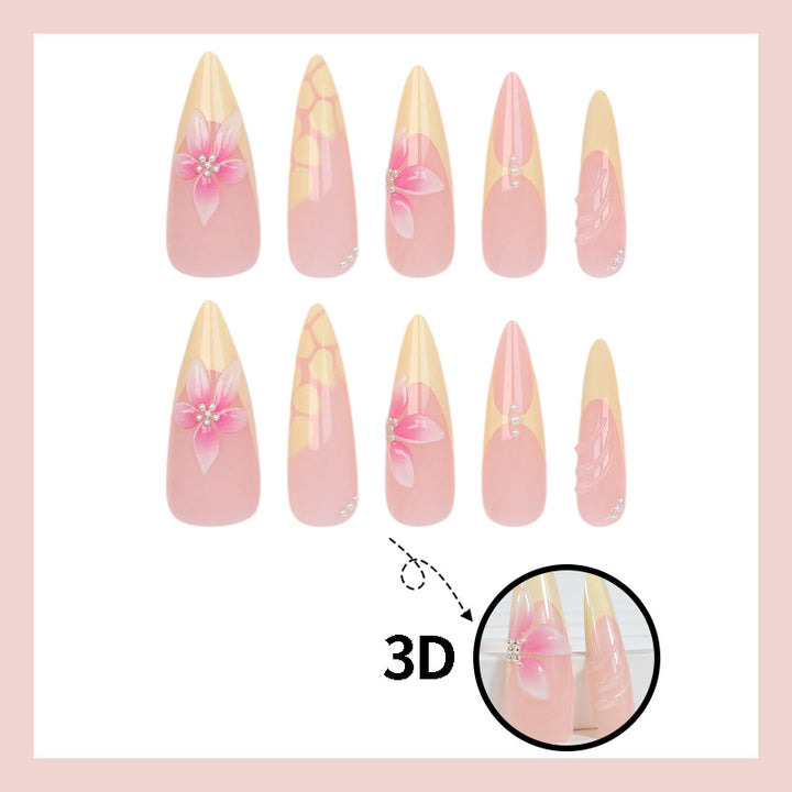 Acrylic nail set with elegant floral pattern and shimmering accents Stornfield