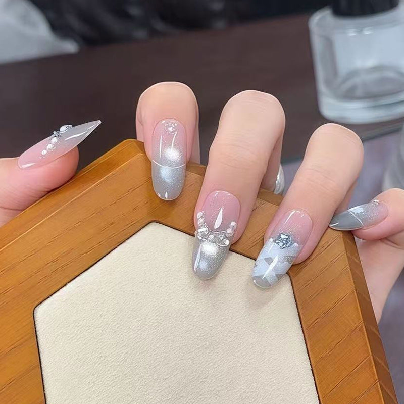 Artificial nail set with glamorous 3D details and radiant accents Stornfield