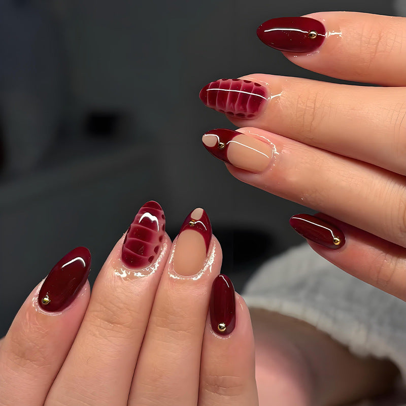 Acrylic nail set with elegant golden accents and trendy design Stornfield