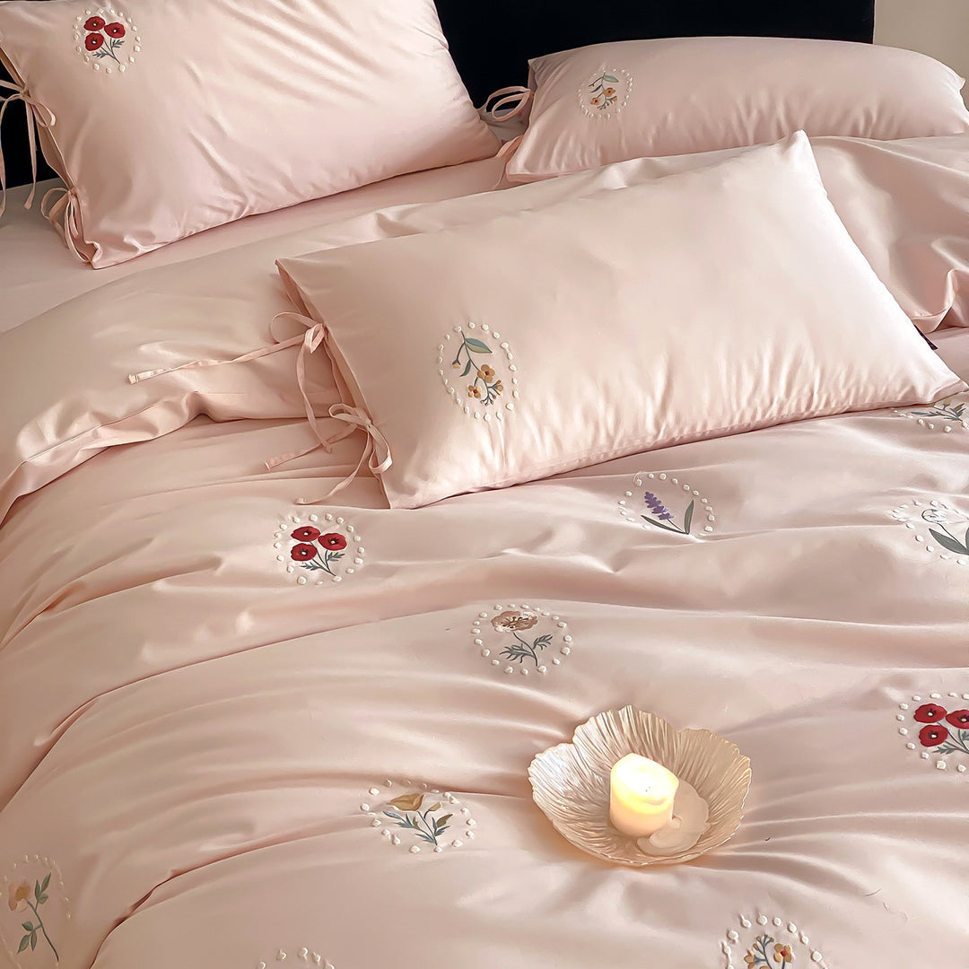 Luxurious cotton satin bedding set with delicate floral embroidery and ties