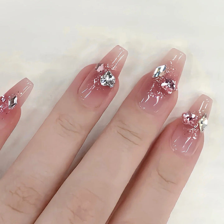 Glamorous artificial nails with glitter and crystal embellishment Stornfield