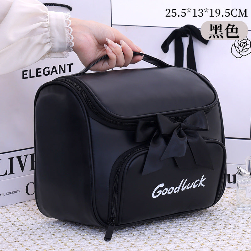 Cosmetic and toiletry bag with elegant bow accent Stornfield