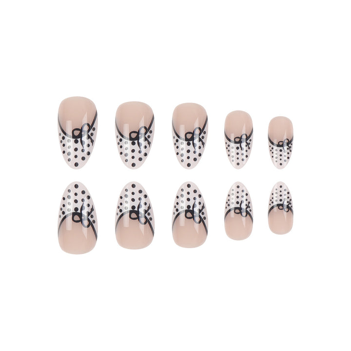 Elegant Stiletto Press-On Nails with Polka Dot Design and Bow Accents Stornfield