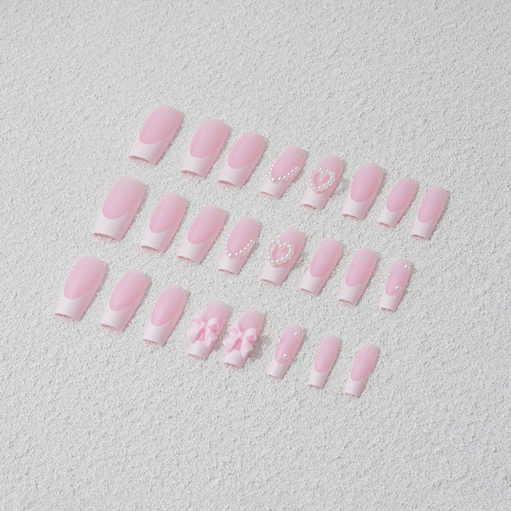 Artificial nail set with 3D bows and pearl accents Stornfield