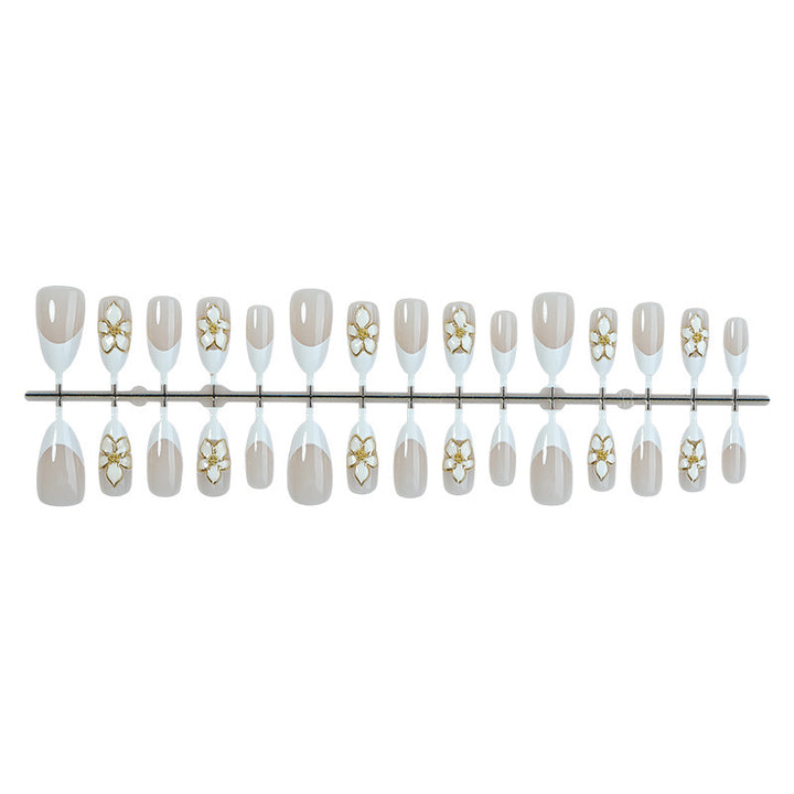 Artificial nail set with floral accents and luxurious glitter Stornfield