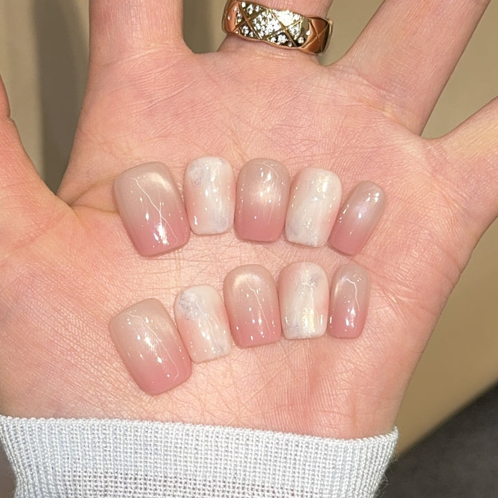 Artificial nails with elegant gradient colors and holographic accents Stornfield