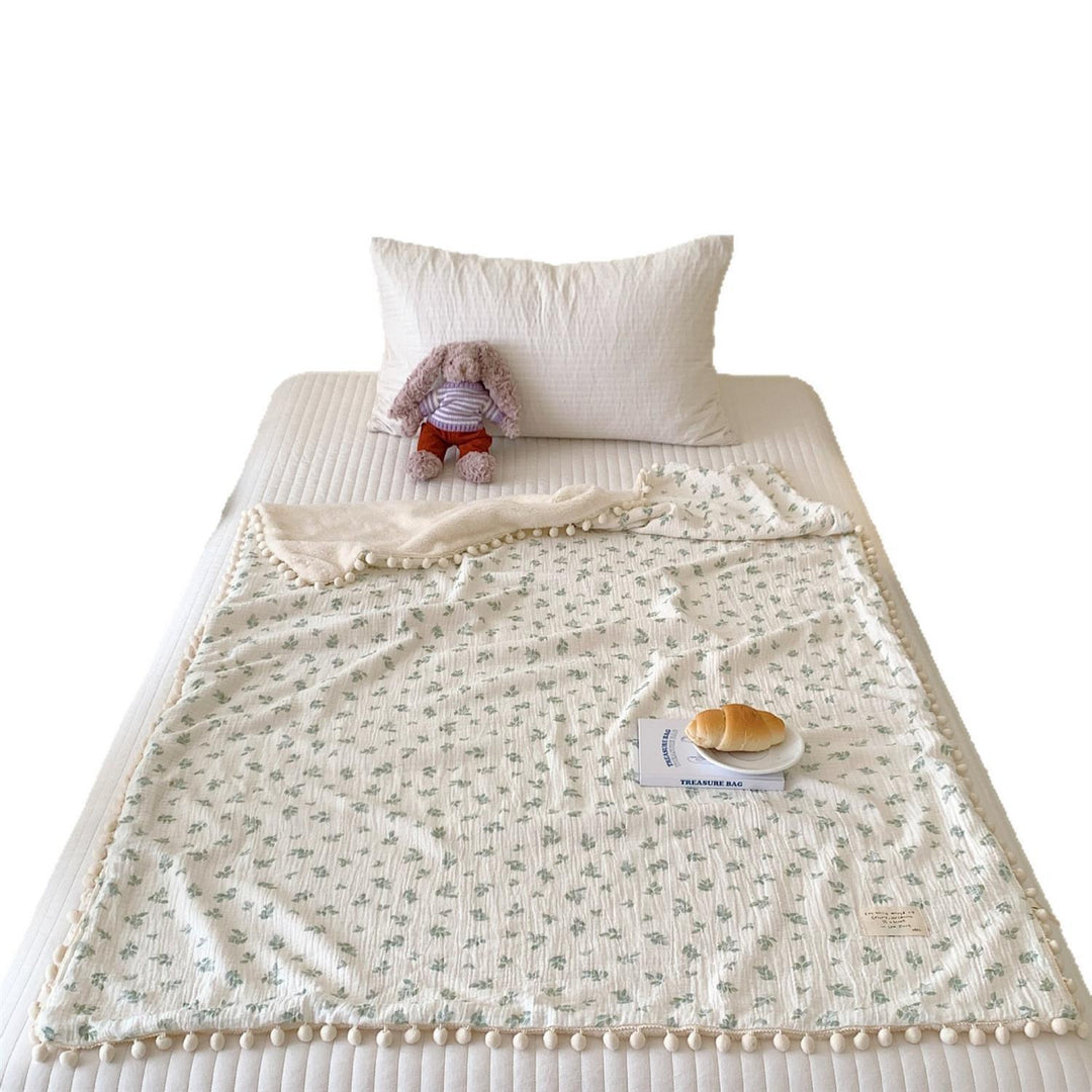 Children's Wende cuddly blanket made of cotton muslin with pompom border