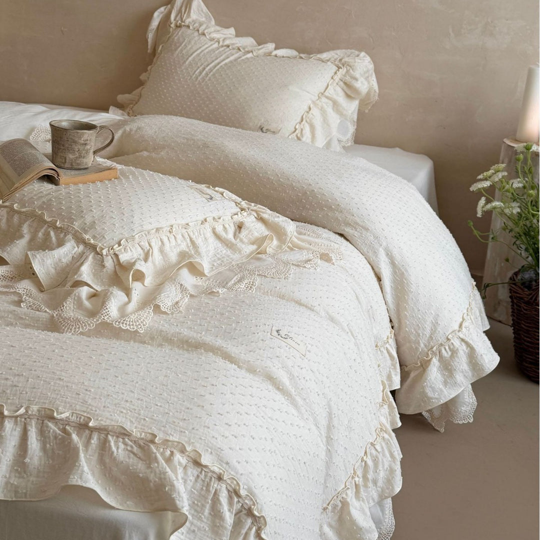 Bedding set in Shabby Chic with textured polka dot look, multi-layered ruffle, and lace finish