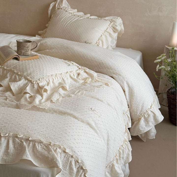 Bedding set in Shabby Chic with textured polka dot look, multi-layered ruffle, and lace finish