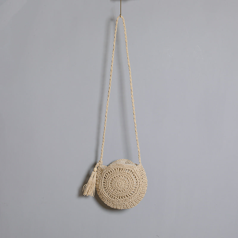 Round bag made of natural jute material with trendy fringe detail Stornfield
