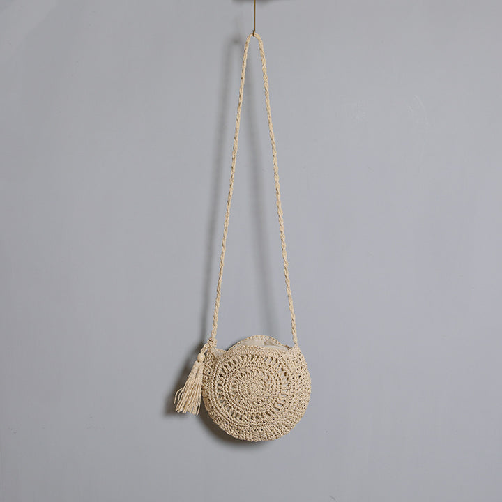 Round bag made of natural jute material with trendy fringe detail Stornfield