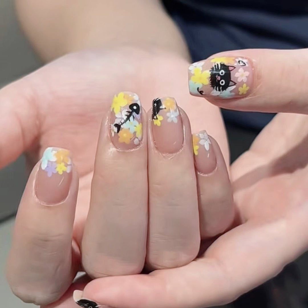 Decorative Long Stiletto Press-On Nails with Heart and Floral Accents Stornfield