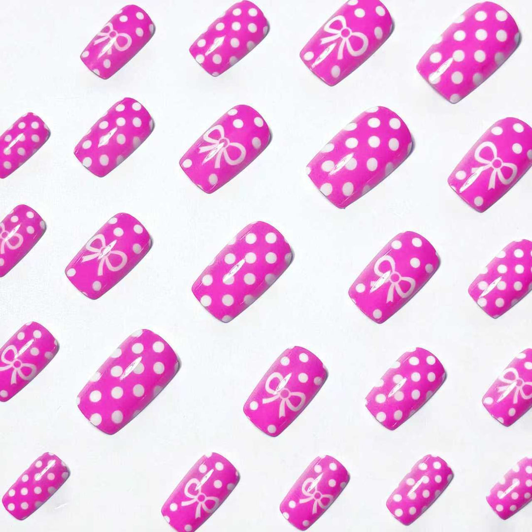 Artificial nails with romantic polka dot pattern and bow Stornfield