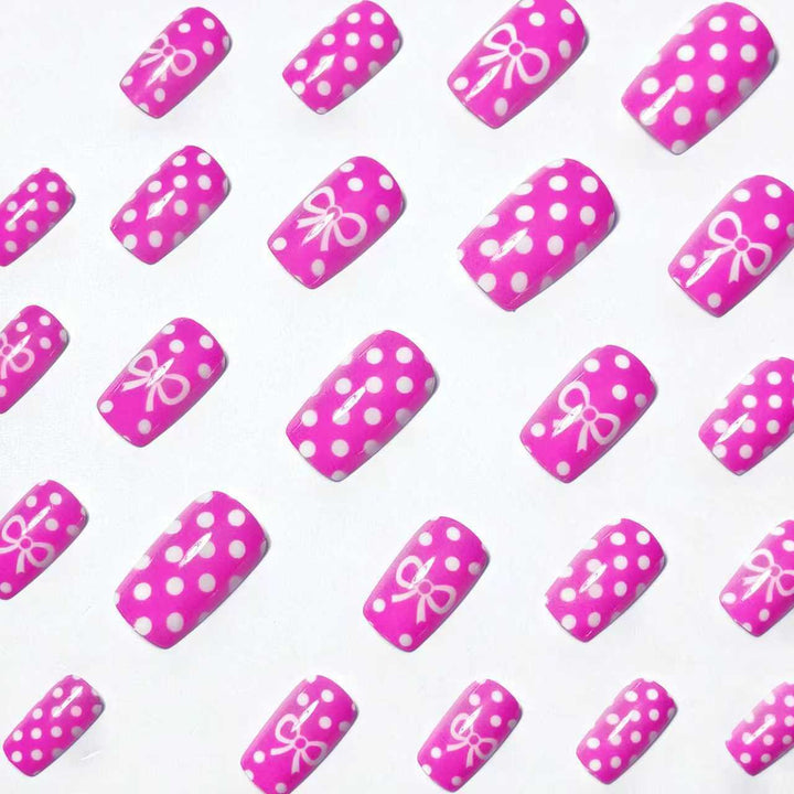 Artificial nails with romantic polka dot pattern and bow Stornfield