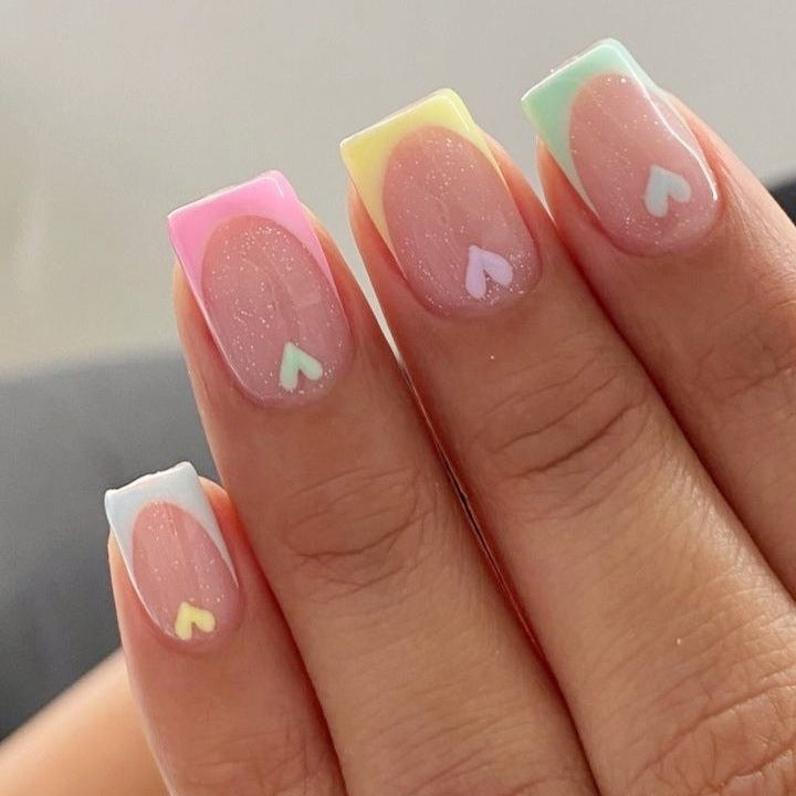 Artificial nail set with playful color gradients and heart motifs Stornfield