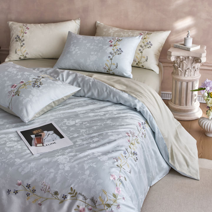 Satin bedding set with fine floral embroidery and jacquard structure