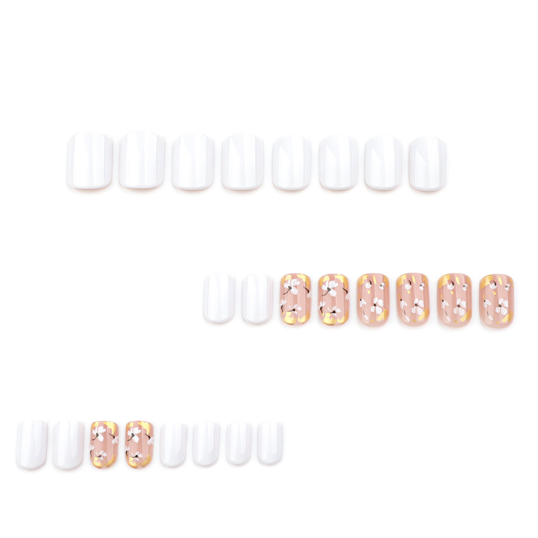 Artificial nail art with delicate flowers and glitter accents Stornfield