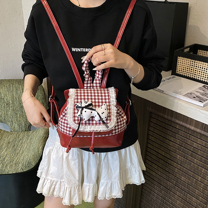 Playful backpack with checkered pattern and animal appliqué Stornfield