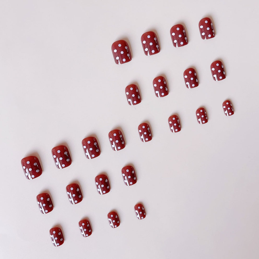Acrylic nail set with stylish chocolate spots and elegant dots Stornfield