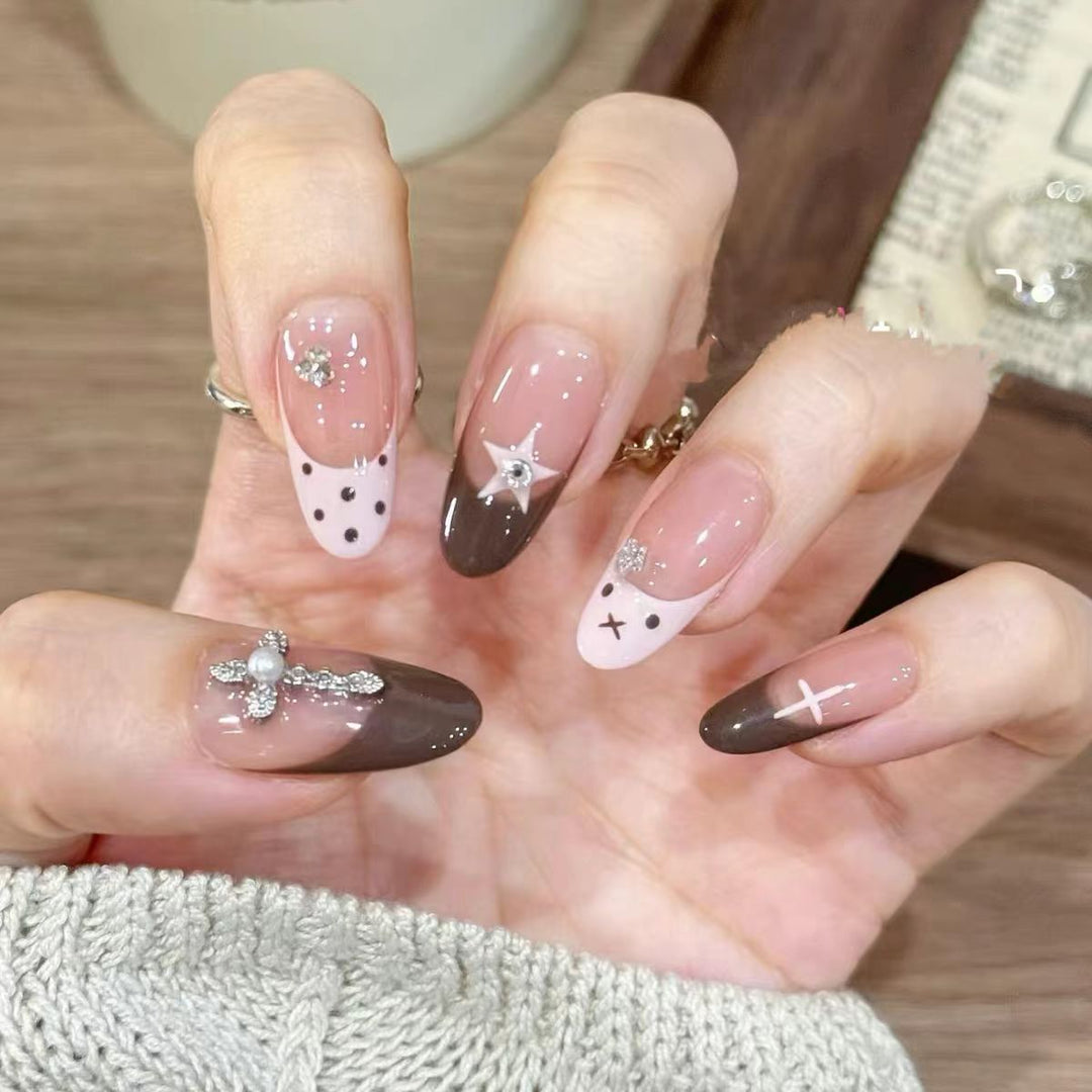 Artificial nails with creative design and sparkling accents Stornfield