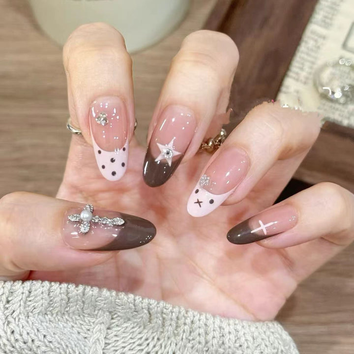 Artificial nails with creative design and sparkling accents Stornfield