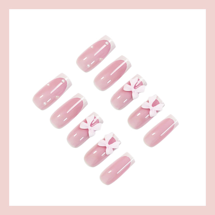 Glamorous artificial nail set with elegant bows and glitter accents Stornfield