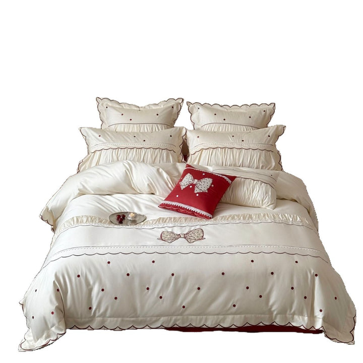 Elegant cotton satin bedding set with decorative bow appliqué and gathered frill