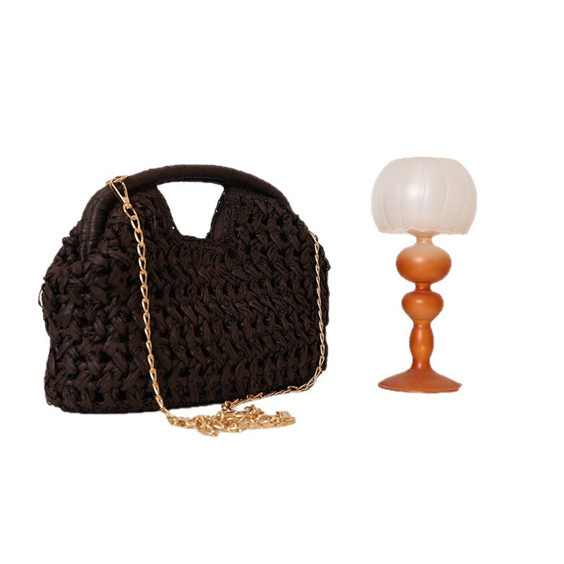 Handcrafted rattan bag with elegant handles and chain straps Stornfield