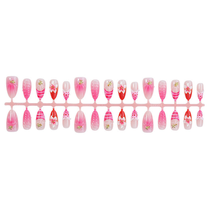 Acrylic nail set with luxurious glitter and flower accents Stornfield