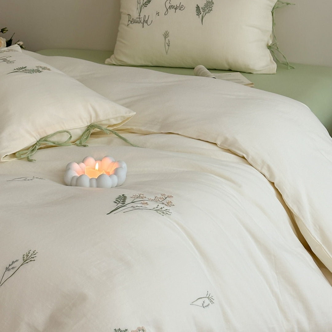 Delicate embroidered cotton bedding set with gentle botanical embroidery and bow ties Stornfield