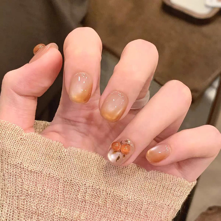 Artificial nails with elegant ombre effect and floral accents Stornfield
