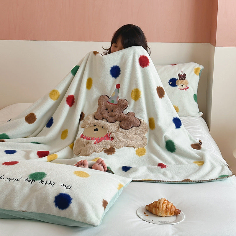 Plaid blanket checkered with appliqued animal motifs and soft velour lining