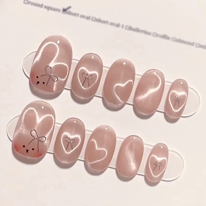 Artificial nail extensions with cute bunny design and hearts Stornfield