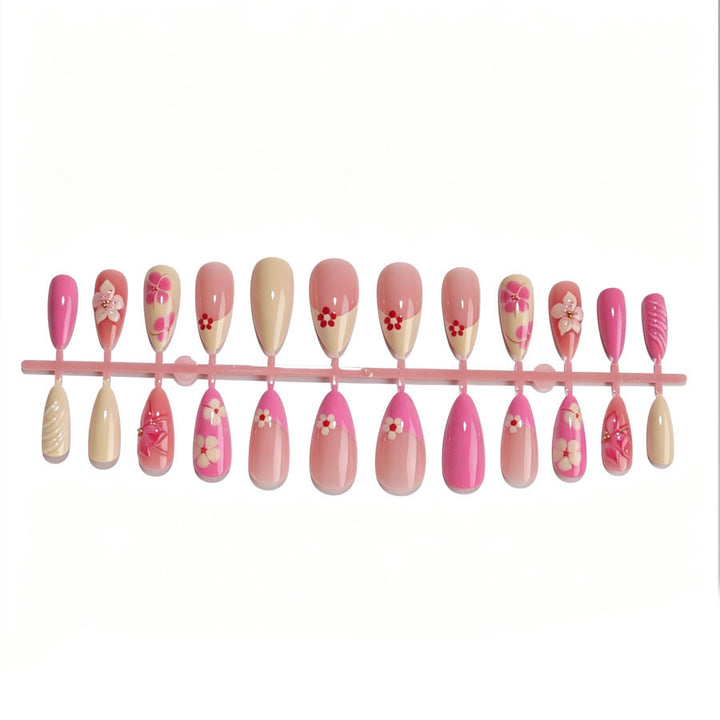 Artificial nail set with floral accents and glitter elements Stornfield