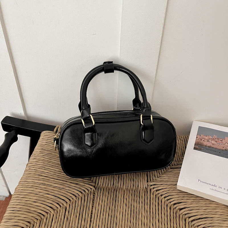 Vintage-Inspired Glossy Handheld Satchel