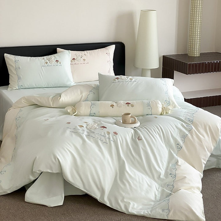 Playful cotton bedding set with plush bunny appliqué and round cushion