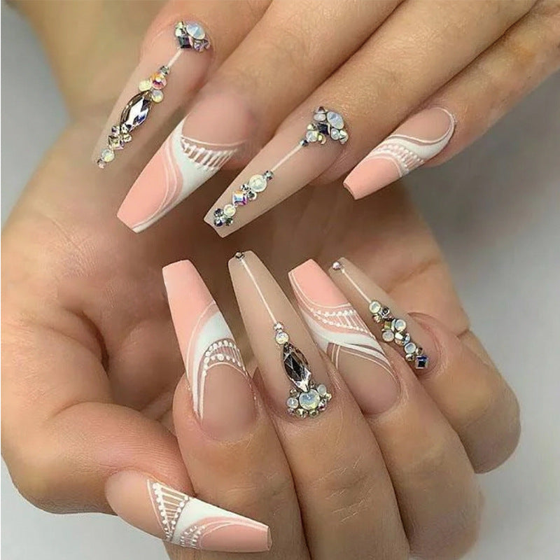 Artful nail extensions with elegant decorations Stornfield