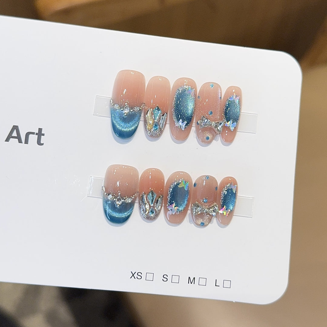 Artificial nail tips with glitter and watercolor effect Stornfield