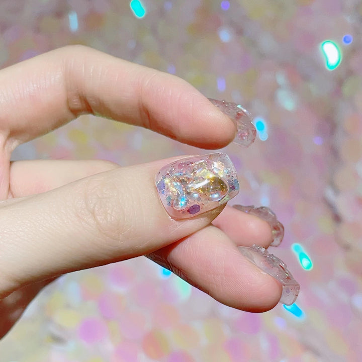 Artful nail tips with glitter accents Stornfield