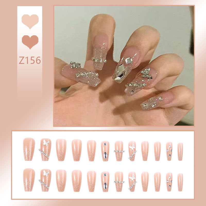 Glamorous artificial nails with sparkling rhinestones and elegant designs Stornfield