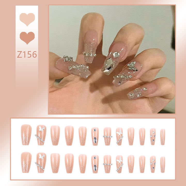 Glamorous artificial nails with sparkling rhinestones and elegant designs Stornfield
