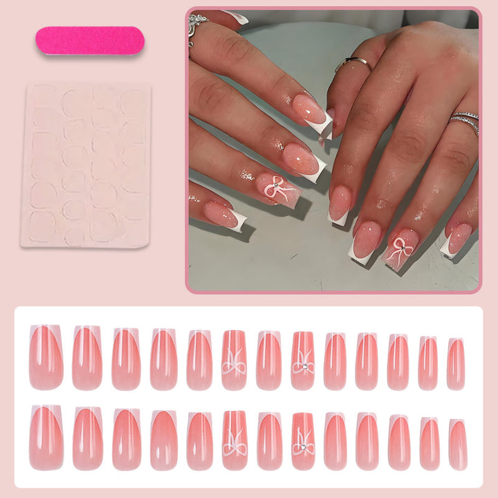 Artificial nail set with elegant tips and delicate bow motifs Stornfield