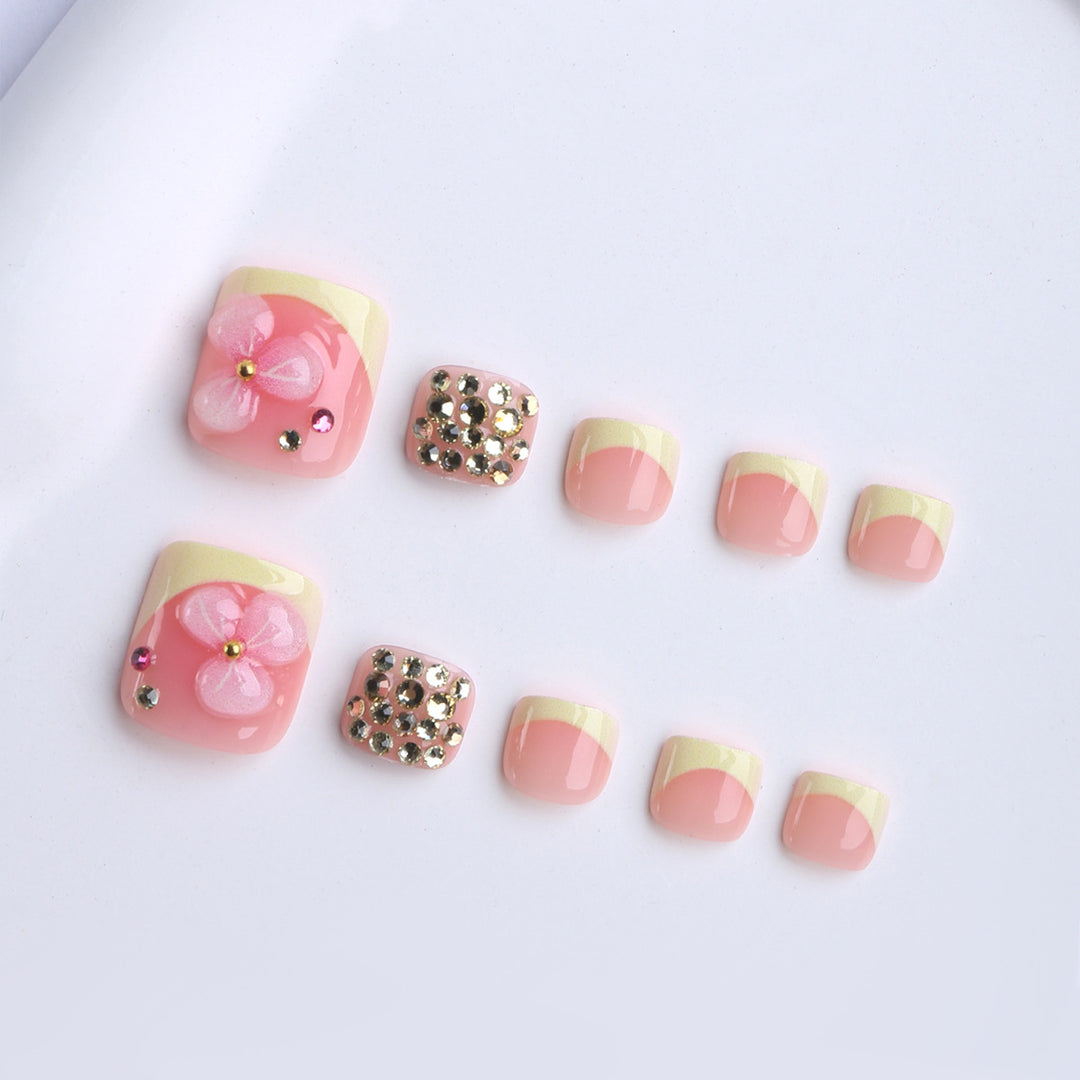 Artificial nail extensions with flower design and glitter accents Stornfield