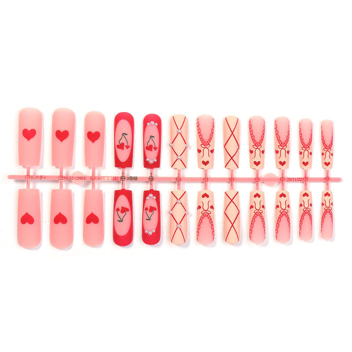 Art nail set with romantic heart and cherry motifs Stornfield