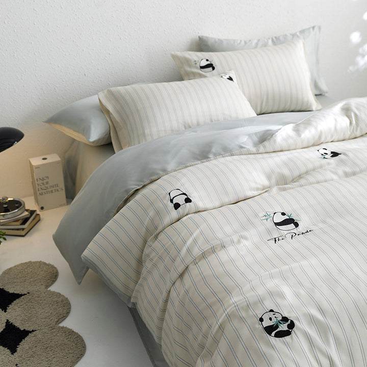 Quilted bed set with panda embroidery and fine stripe texture