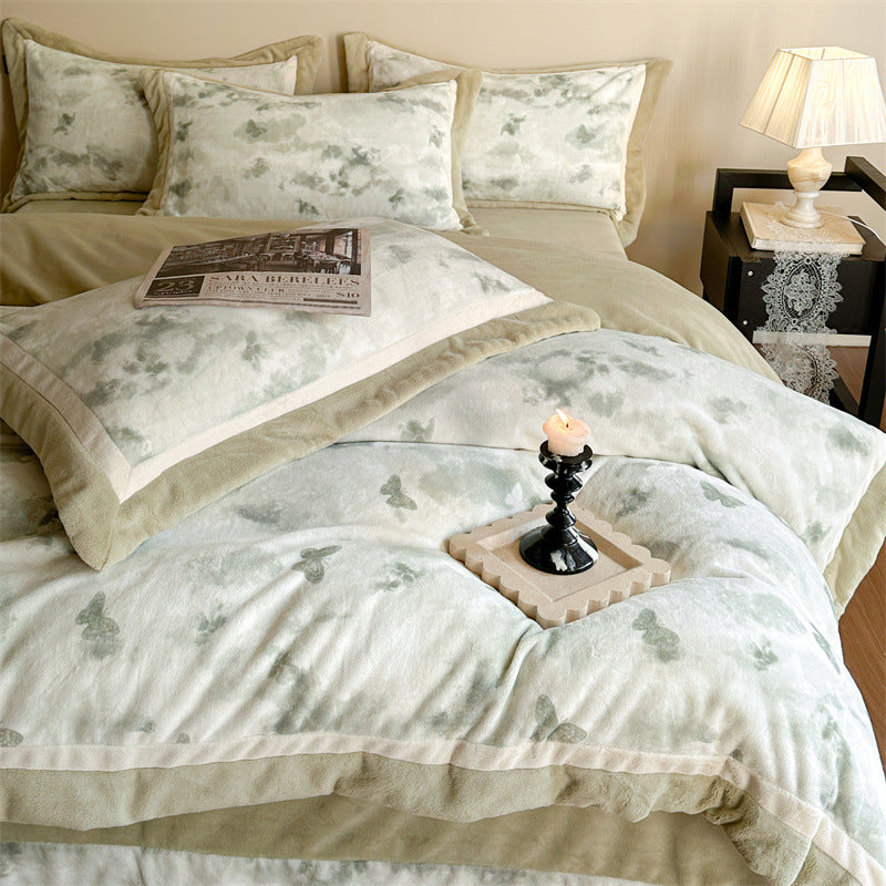Luxurious quilted bedding set with velvet trim and floral branch motif
